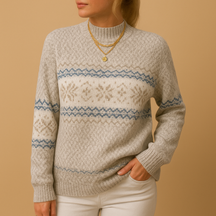 Women’s Christmas sweater with festive print, available in blue, apricot, grey, and pink – perfect for stylish winter celebrations.