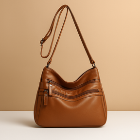 Compact anti-theft crossbody bag for women with secure zip closures, adjustable strap, and water-resistant design for everyday use.