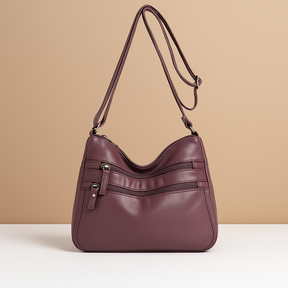 Compact anti-theft crossbody bag for women with secure zip closures, adjustable strap, and water-resistant design for everyday use.