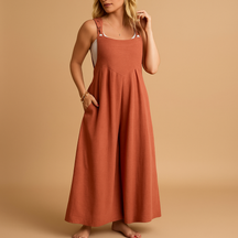 Women’s relaxed cotton dungaree jumpsuit with adjustable straps in various colours, ideal for summer, errands, and lounging in comfort