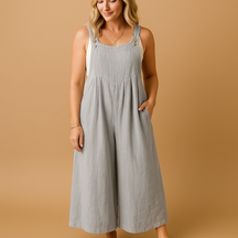 Women’s relaxed cotton dungaree jumpsuit with adjustable straps in various colours, ideal for summer, errands, and lounging in comfort