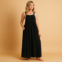 Women’s relaxed cotton dungaree jumpsuit with adjustable straps in various colours, ideal for summer, errands, and lounging in comfort
