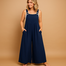 Women’s relaxed cotton dungaree jumpsuit with adjustable straps in various colours, ideal for summer, errands, and lounging in comfort