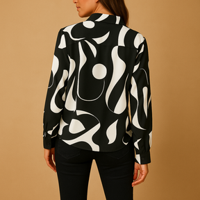 Elegant printed long sleeve blouse for women in apricot and black, with a smooth fit and refined design for casual or formal outfits.