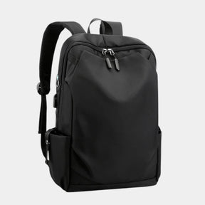Men’s anti-theft travel backpack with USB port, water-resistant nylon fabric, and hidden security pockets for commuting and travel