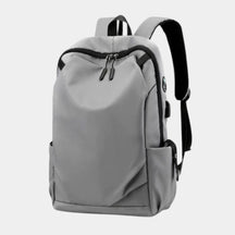 Men’s anti-theft travel backpack with USB port, water-resistant nylon fabric, and hidden security pockets for commuting and travel