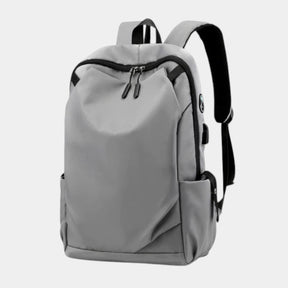 Men’s anti-theft travel backpack with USB port, water-resistant nylon fabric, and hidden security pockets for commuting and travel
