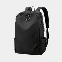 Men’s anti-theft travel backpack with USB port, water-resistant nylon fabric, and hidden security pockets for commuting and travel