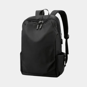 Men’s anti-theft travel backpack with USB port, water-resistant nylon fabric, and hidden security pockets for commuting and travel