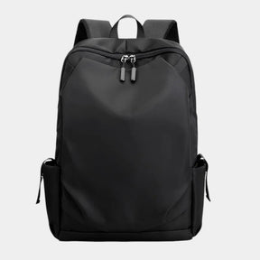 Men’s anti-theft travel backpack with USB port, water-resistant nylon fabric, and hidden security pockets for commuting and travel