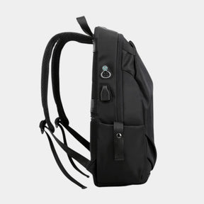 Men’s anti-theft travel backpack with USB port, water-resistant nylon fabric, and hidden security pockets for commuting and travel
