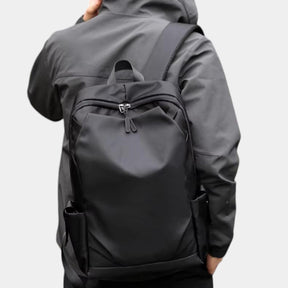 Men’s anti-theft travel backpack with USB port, water-resistant nylon fabric, and hidden security pockets for commuting and travel