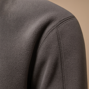 Men’s fleece half zip pullover with soft fabric, warm and versatile design in dark grey, beige, and brown for autumn and winter wear.