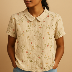 Women’s loose floral blouse with breathable fabric and multicolor flower pattern, ideal for casual summer days.