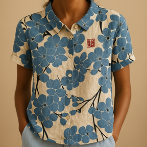 Women’s loose floral blouse with breathable fabric and multicolor flower pattern, ideal for casual summer days.