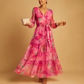 Flowy long summer dress with sleeves for women, featuring an A-line silhouette and lightweight fabric, ideal for casual and semi-formal summer occasions.
