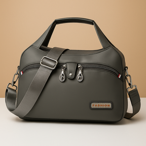 Lightweight messenger bag for women with multiple zippered compartments, hidden anti-theft pocket, and adjustable strap, ideal for travel and everyday use.