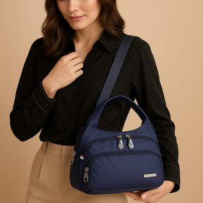 Lightweight messenger bag for women with multiple zippered compartments, hidden anti-theft pocket, and adjustable strap, ideal for travel and everyday use.