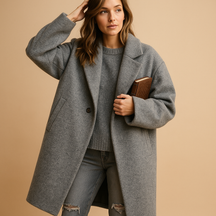 Elegant long autumn coat for women with practical pockets and a relaxed fit, ideal for stylish everyday wear in cooler seasons.