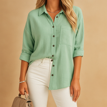 Long sleeve polo shirt for women in cotton blend with button-up collar and chest pocket, perfect for work or casual wear.