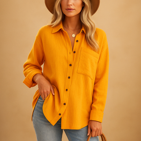 Long sleeve polo shirt for women in cotton blend with button-up collar and chest pocket, perfect for work or casual wear.