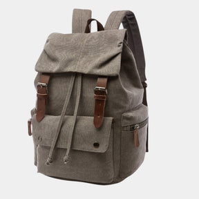 Men’s canvas travel backpack with padded laptop sleeve, drawstring and magnetic closures, ideal for work, hiking, or everyday use
