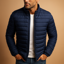 Men’s puffer jacket with hood and insulation, designed for warmth, wind protection, and comfort on cold winter days.