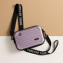 Stylish mini suitcase crossbody bag for women, durable and lightweight, perfect for daily essentials and fashion-forward looks.