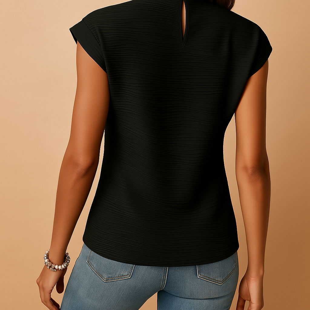 Pleated elegant blouse for women in classic tones with flattering fit, ideal for work, everyday wear, or evenings out in all seasons.