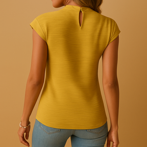 Pleated elegant blouse for women in classic tones with flattering fit, ideal for work, everyday wear, or evenings out in all seasons.