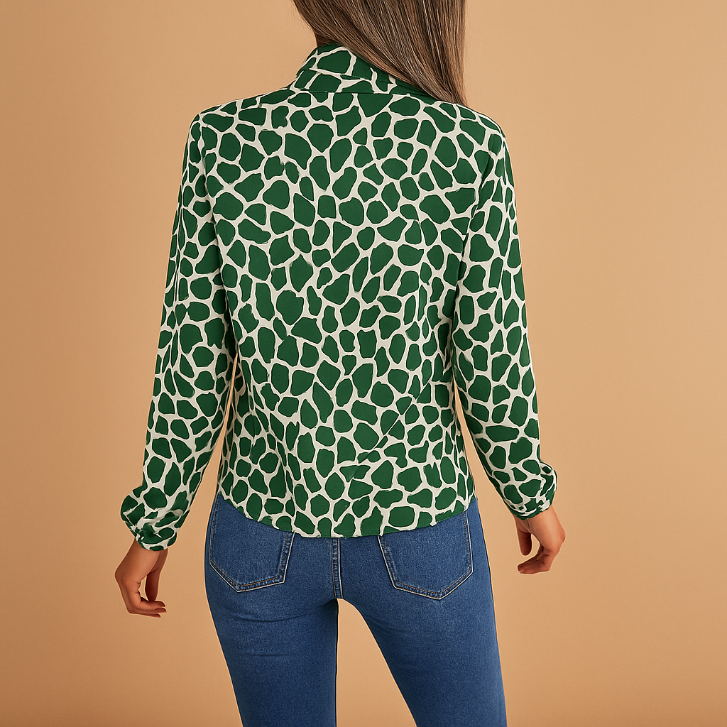 Elegant green polka dot blouse for women with bow detail and elastic cuffs, perfect for both work and everyday style.