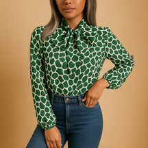Elegant green polka dot blouse for women with bow detail and elastic cuffs, perfect for both work and everyday style.