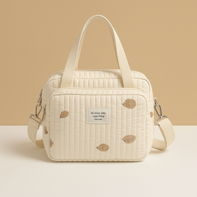 Quilted baby travel bag for women with insulated interior, cushioned design, and multiple compartments—perfect for on-the-go mums and daily baby care.