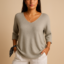 Relaxed elegant top for women in soft neutral tones with a modern fit, perfect for casual wear or at-home comfort.