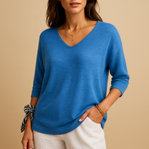 Relaxed elegant top for women in soft neutral tones with a modern fit, perfect for casual wear or at-home comfort.
