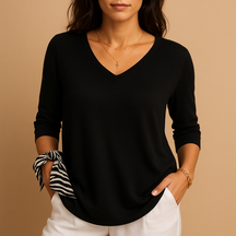 Relaxed elegant top for women in soft neutral tones with a modern fit, perfect for casual wear or at-home comfort.