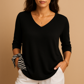 Relaxed elegant top for women in soft neutral tones with a modern fit, perfect for casual wear or at-home comfort.