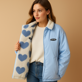 Reversible winter coat for women featuring two stylish looks, ideal for warmth and elegance during cold days. Available in black, blue, and pink.