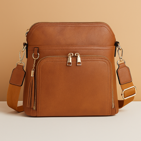 Women's RFID crossbody bag with anti-theft pocket and water-resistant faux leather exterior, convertible to clutch with tassel detail