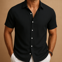 Men’s short-sleeved summer shirt in a solid color with a clean collar, perfect for warm days, casual events, or relaxed office wear.