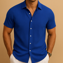 Men’s short-sleeved summer shirt in a solid color with a clean collar, perfect for warm days, casual events, or relaxed office wear.