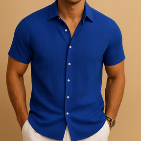 Men’s short-sleeved summer shirt in a solid color with a clean collar, perfect for warm days, casual events, or relaxed office wear.