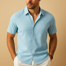 Men’s short-sleeved summer shirt in a solid color with a clean collar, perfect for warm days, casual events, or relaxed office wear.