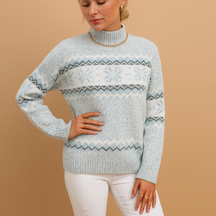 Women’s turtleneck sweater with snowflake pattern and ribbed cuffs, made from soft wool blend—ideal for winter warmth and festive occasions.