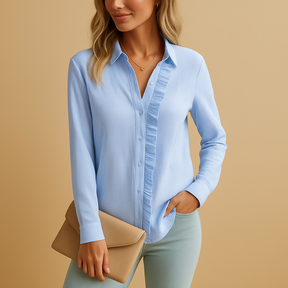 Striped ruffle blouse for women in black, white, pink, or blue with button details and a flattering, feminine fit.