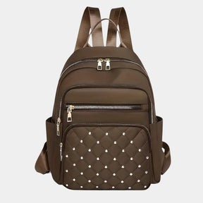 Women’s stylish backpack featuring water-resistant material, anti-theft back pocket, and multiple compartments for daily and travel use