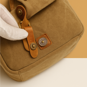 Men’s vintage DSLR camera bag made of water-resistant batik canvas with padded interior and versatile strap options for travel or studio use