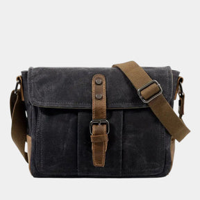 Men’s vintage canvas messenger bag with waterproof leather detailing, adjustable strap, and compartments for daily essentials