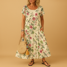 Vintage floral summer dress for women with boat neckline, pleated design, and short sleeves, perfect for warm weather and casual elegance.