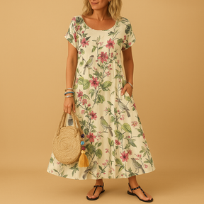 Vintage floral summer dress for women with boat neckline, pleated design, and short sleeves, perfect for warm weather and casual elegance.